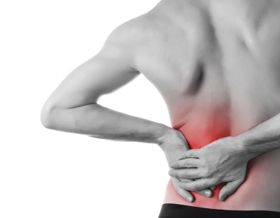 person holding side of lower back in pain